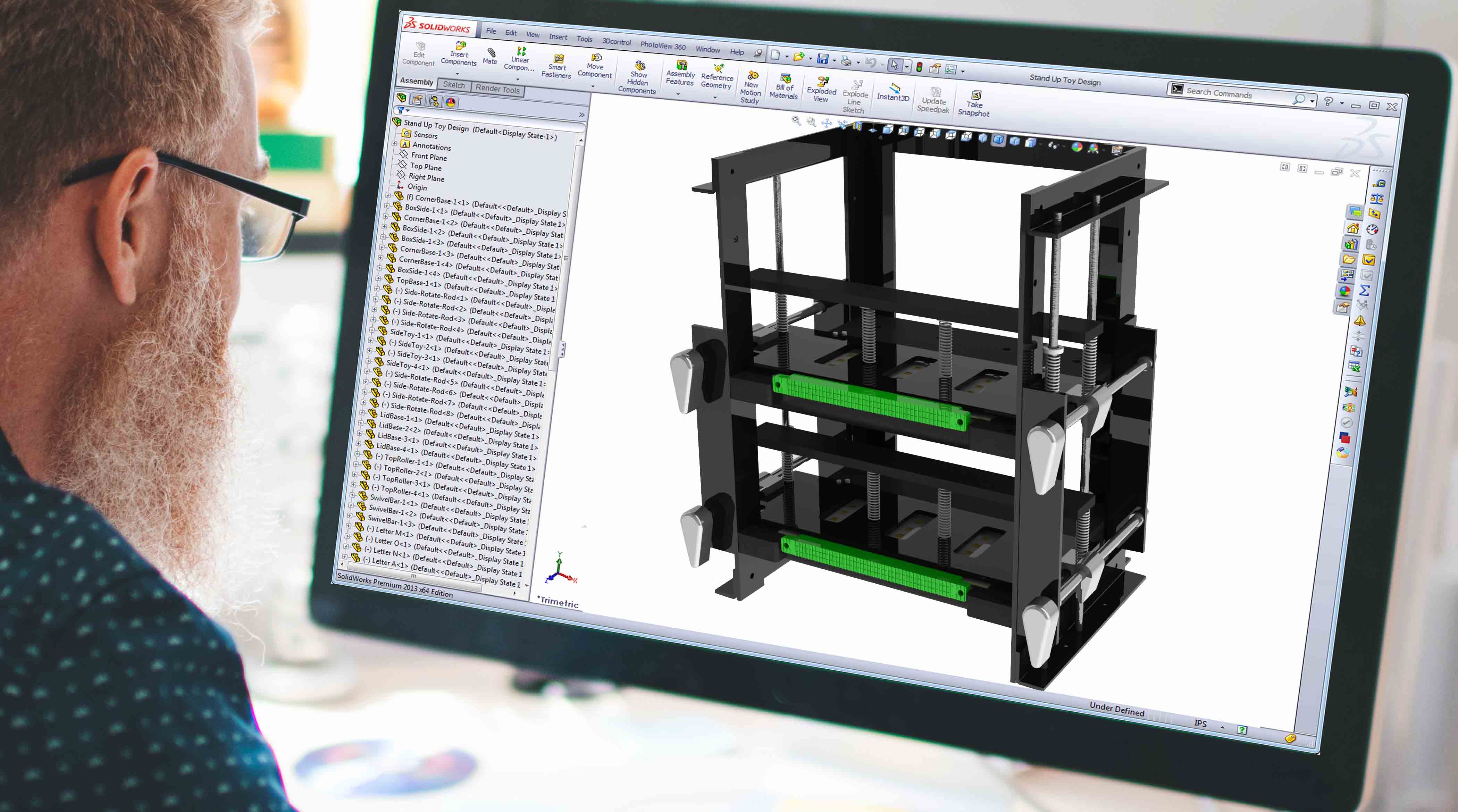 Working on computer creating a 3D Cad model in computer generated software building an industrial design